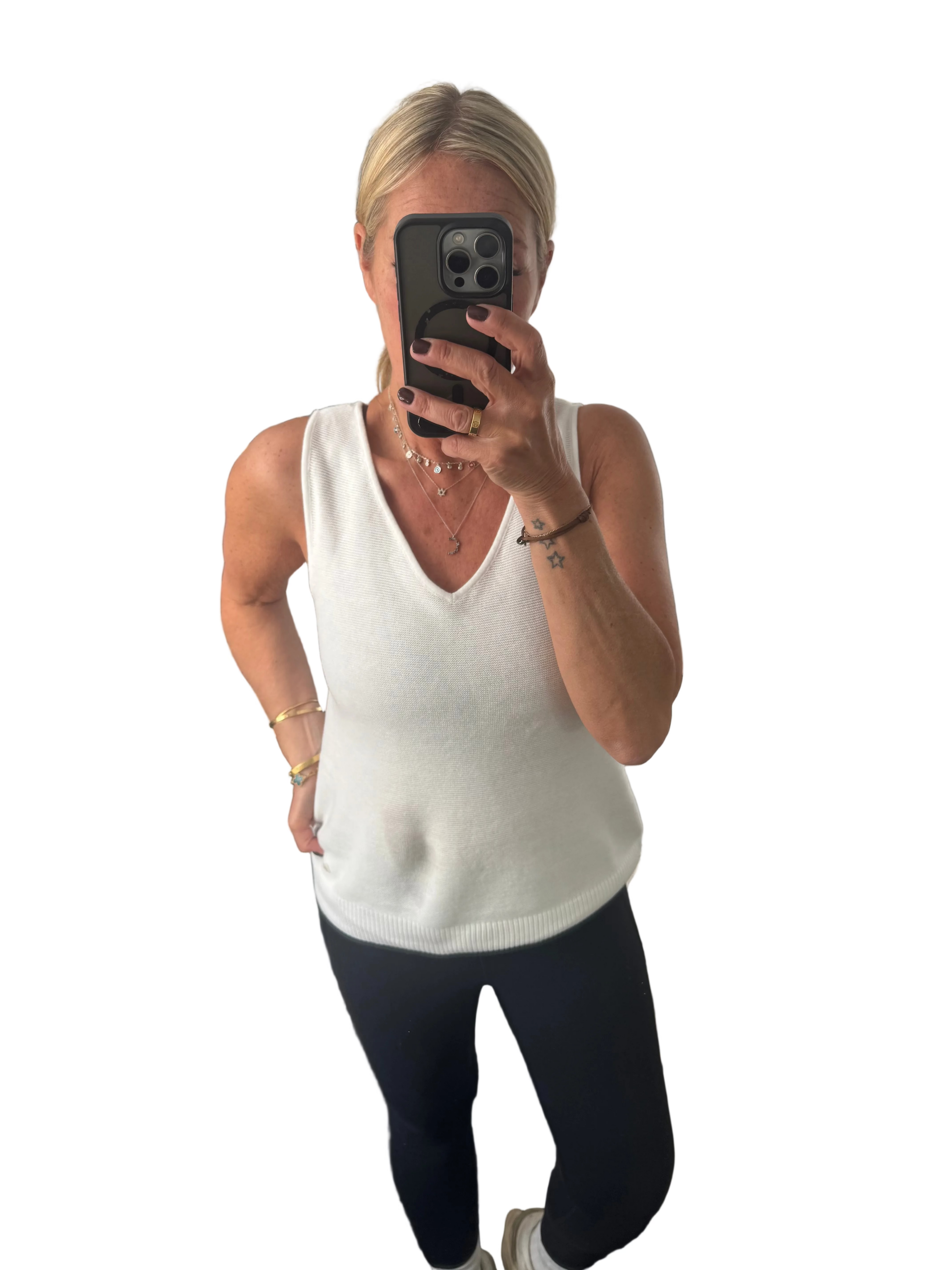 Cream sleeveless knit white top