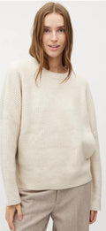 women wearing cream knit jumper